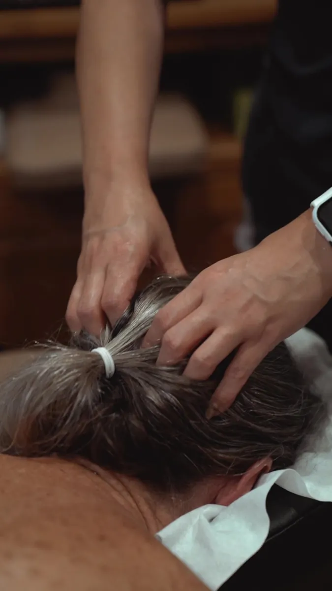 Scalp and neck massage at the end of a medical massage session