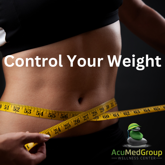Person measuring waist for weight control concept.